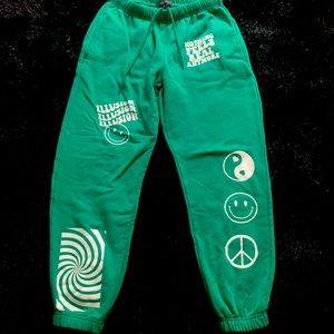 Cute Green sweatpants with cute designs on front.
